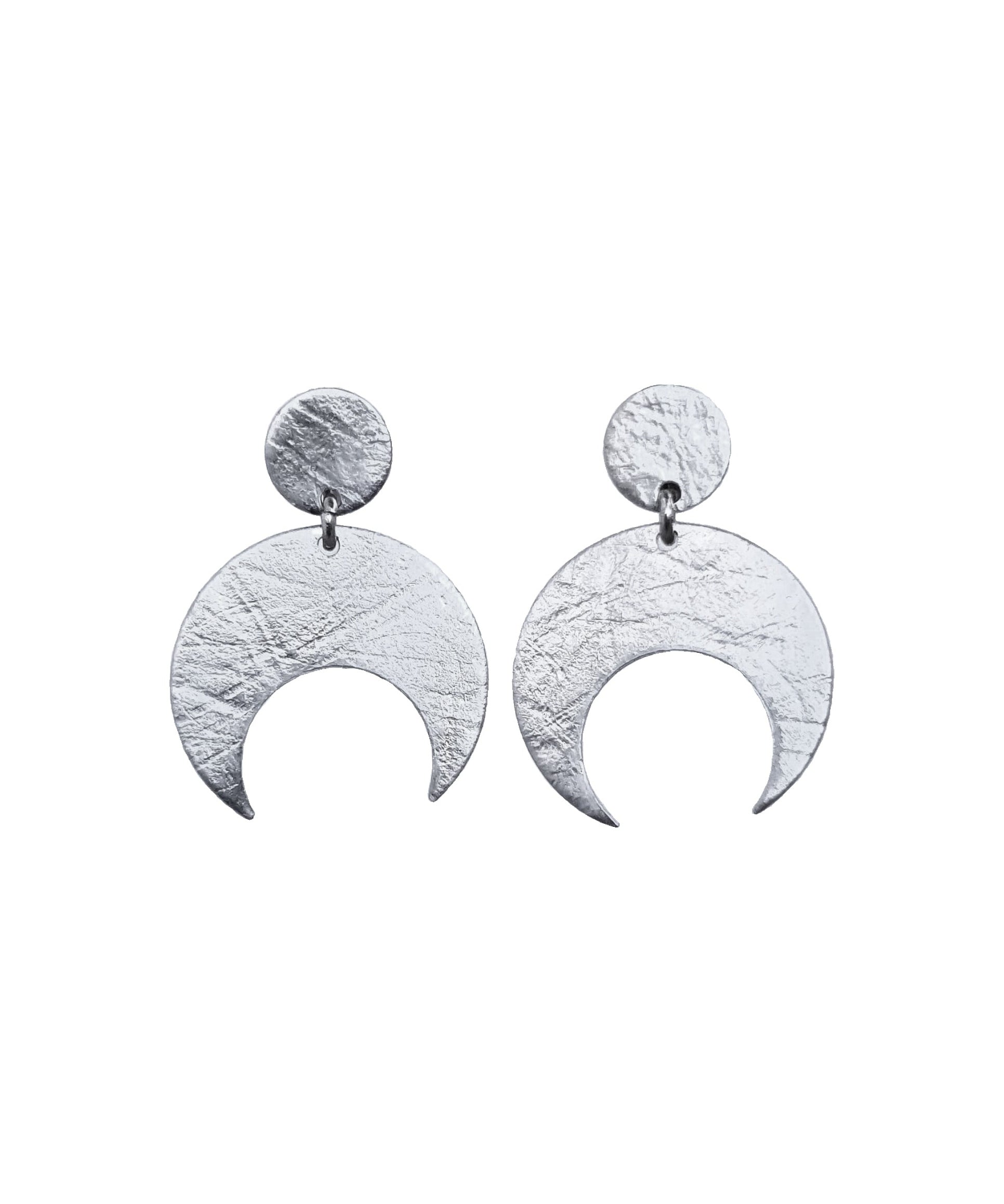 Pair of Sterling Silver Lunar stud earrings on a white background. These earrings feature a textured crescent moon design.