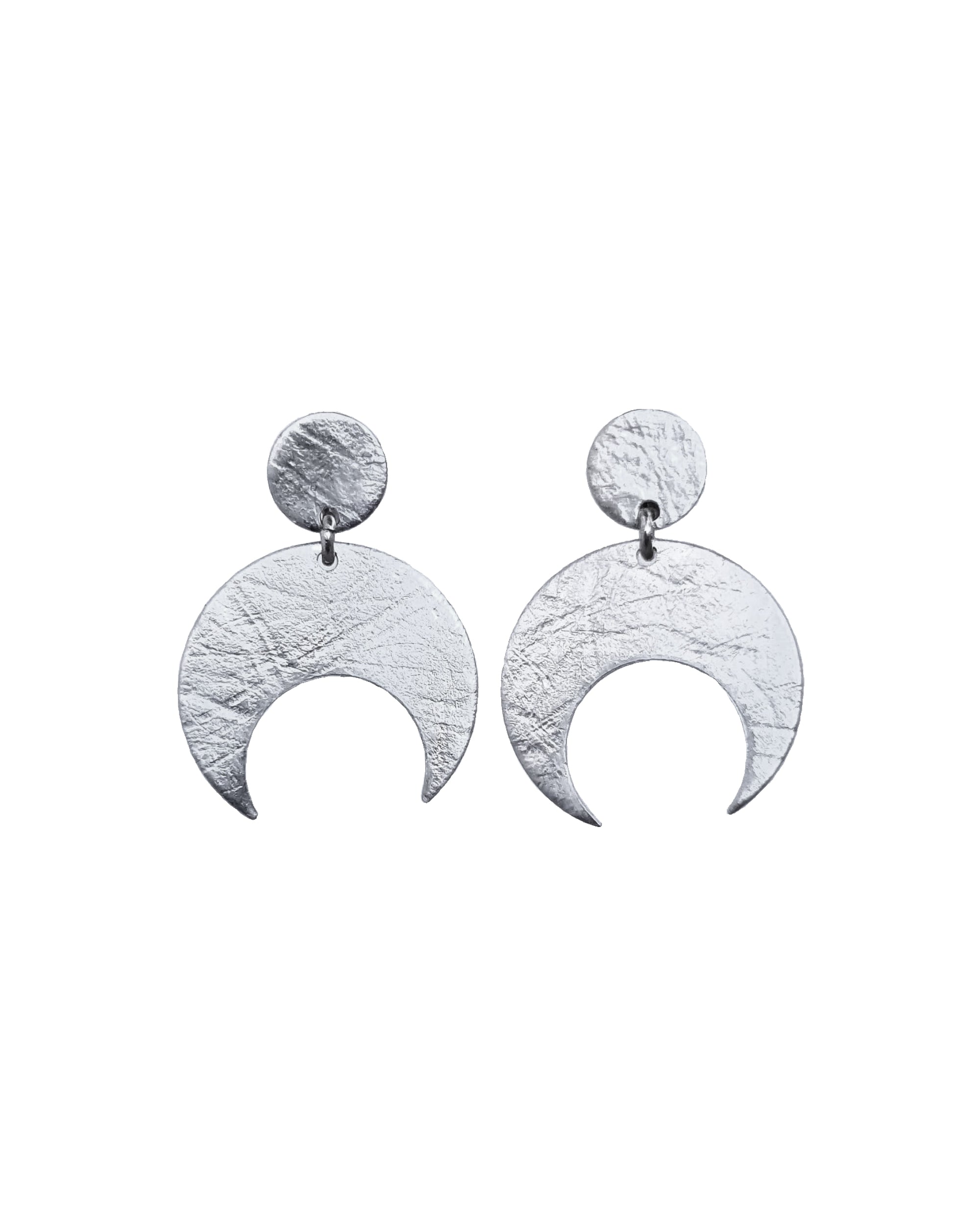 Pair of Sterling Silver Lunar stud earrings on a white background. These earrings feature a textured crescent moon design.