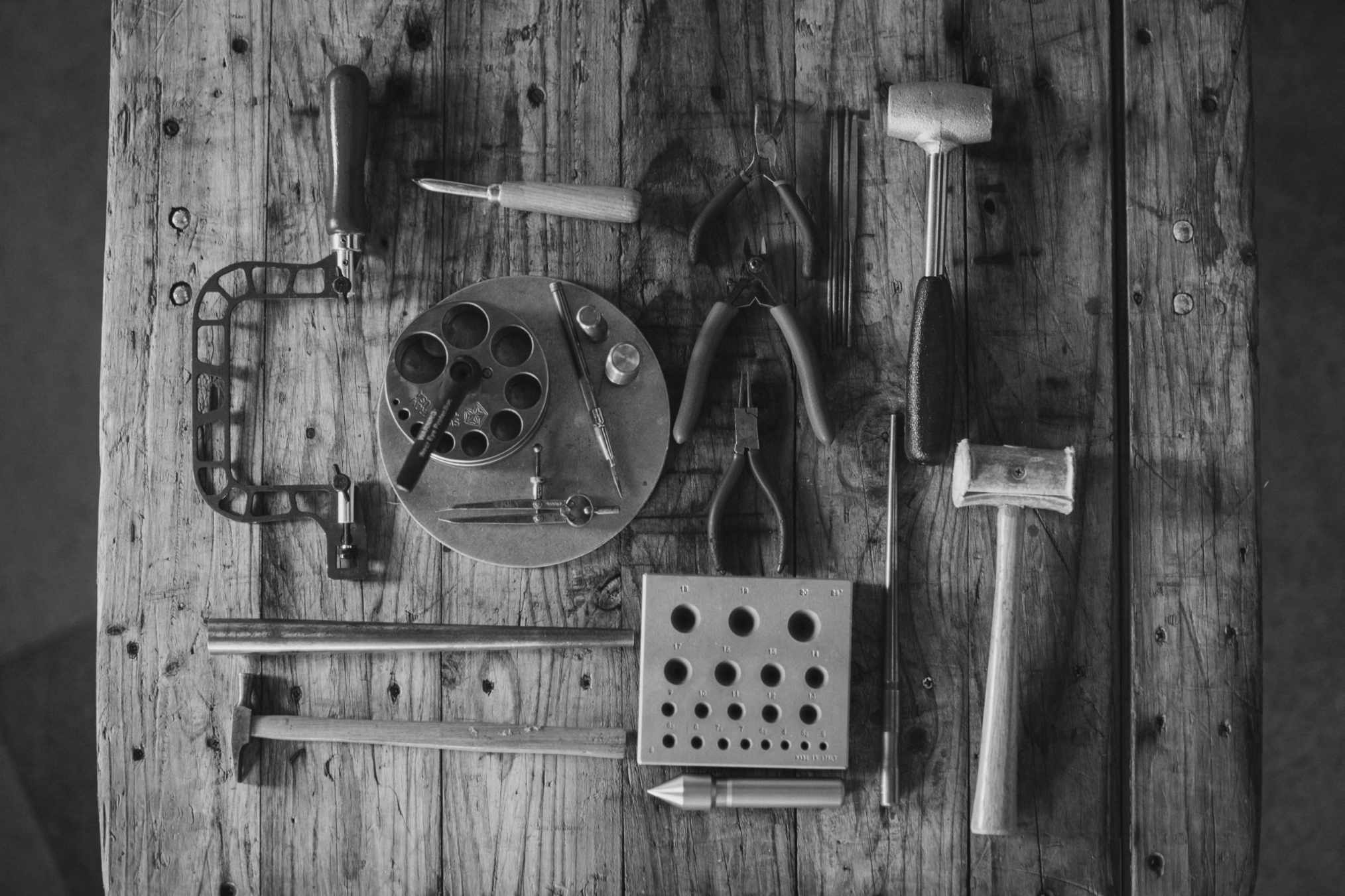Jewellery Tools on a wooden work bench by Emily Eliza Arlotte
