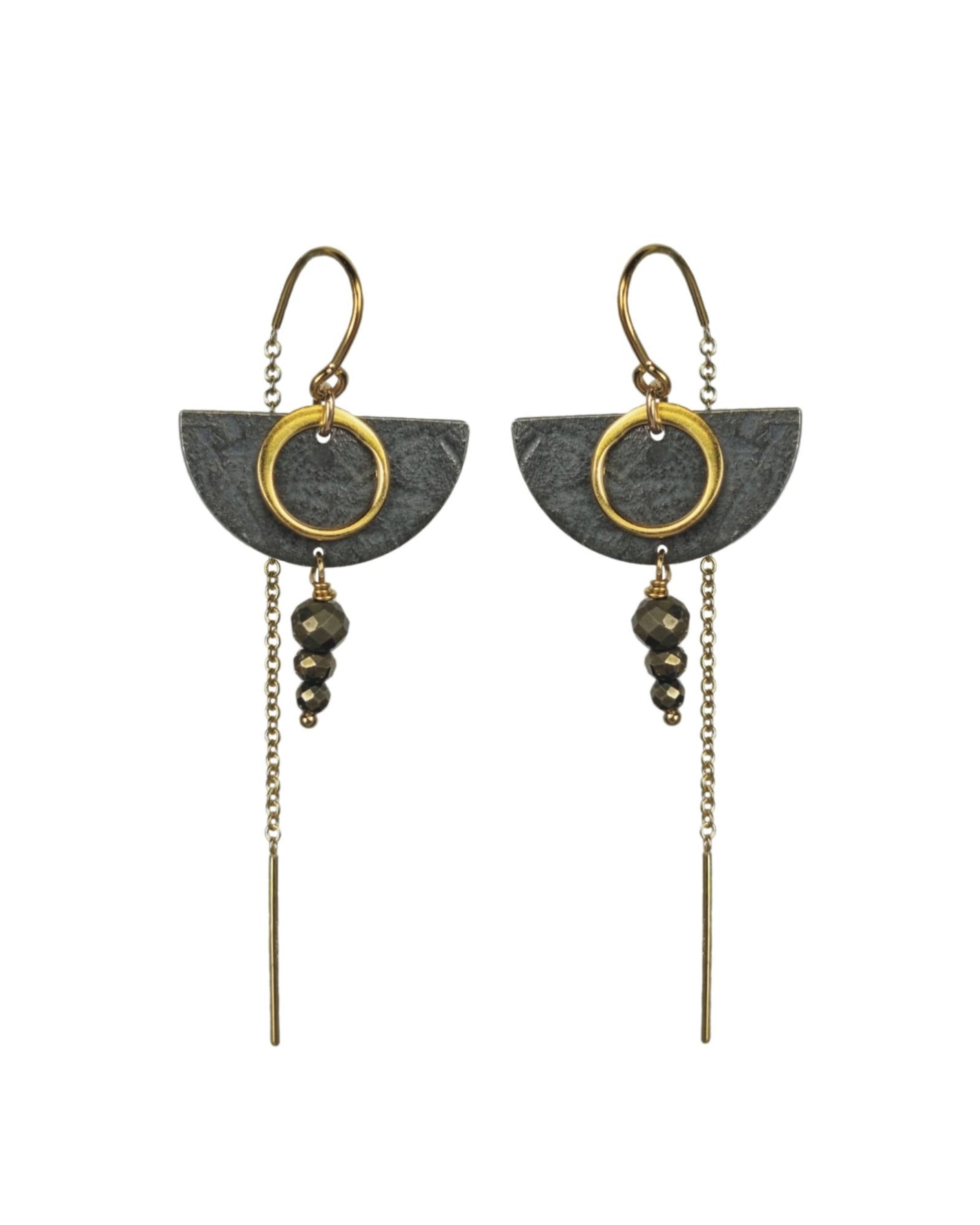 Pair of earrings with geometric design on a white background
