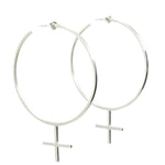 The Venus Hoop Sterling Silver Earrings, handmade by Emily Eliza Arlotte in Hobart, Tasmania sit on a white background. The oversized hoops are in the shape of the feminist femme symbol.