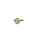 Aura Gold Oval Crystal Opal Ring on a white background, featuring an Australian Crystal Opal with a vibrant play of colour, set in a warm gold band