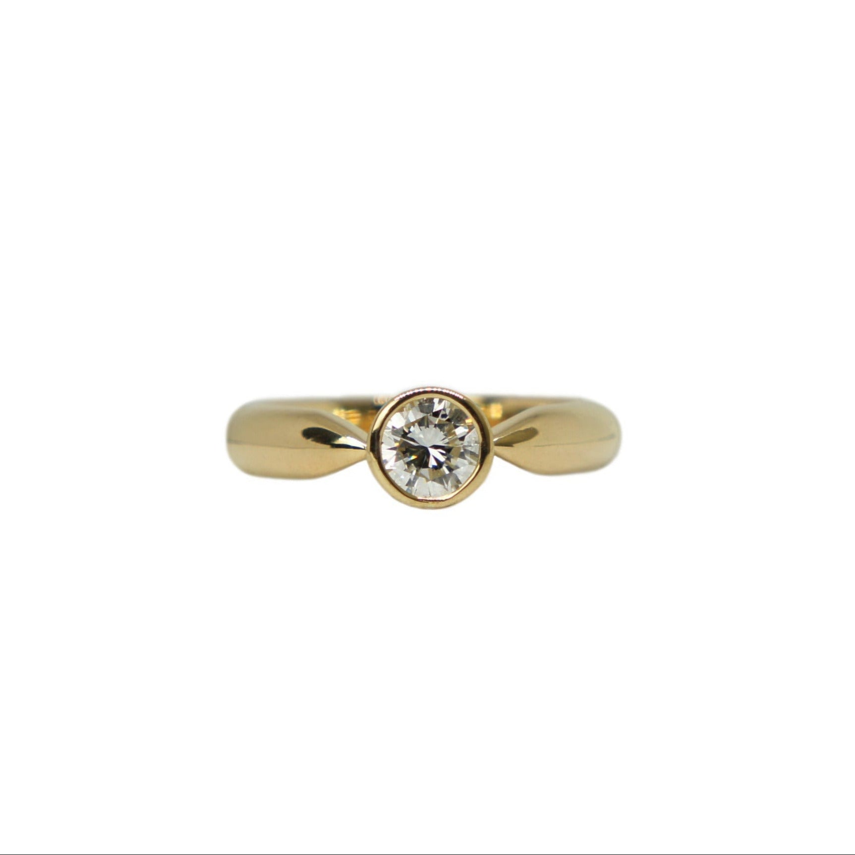 18ct Gold Engagement Ring with n Heirloom Diamond, on a white background.
