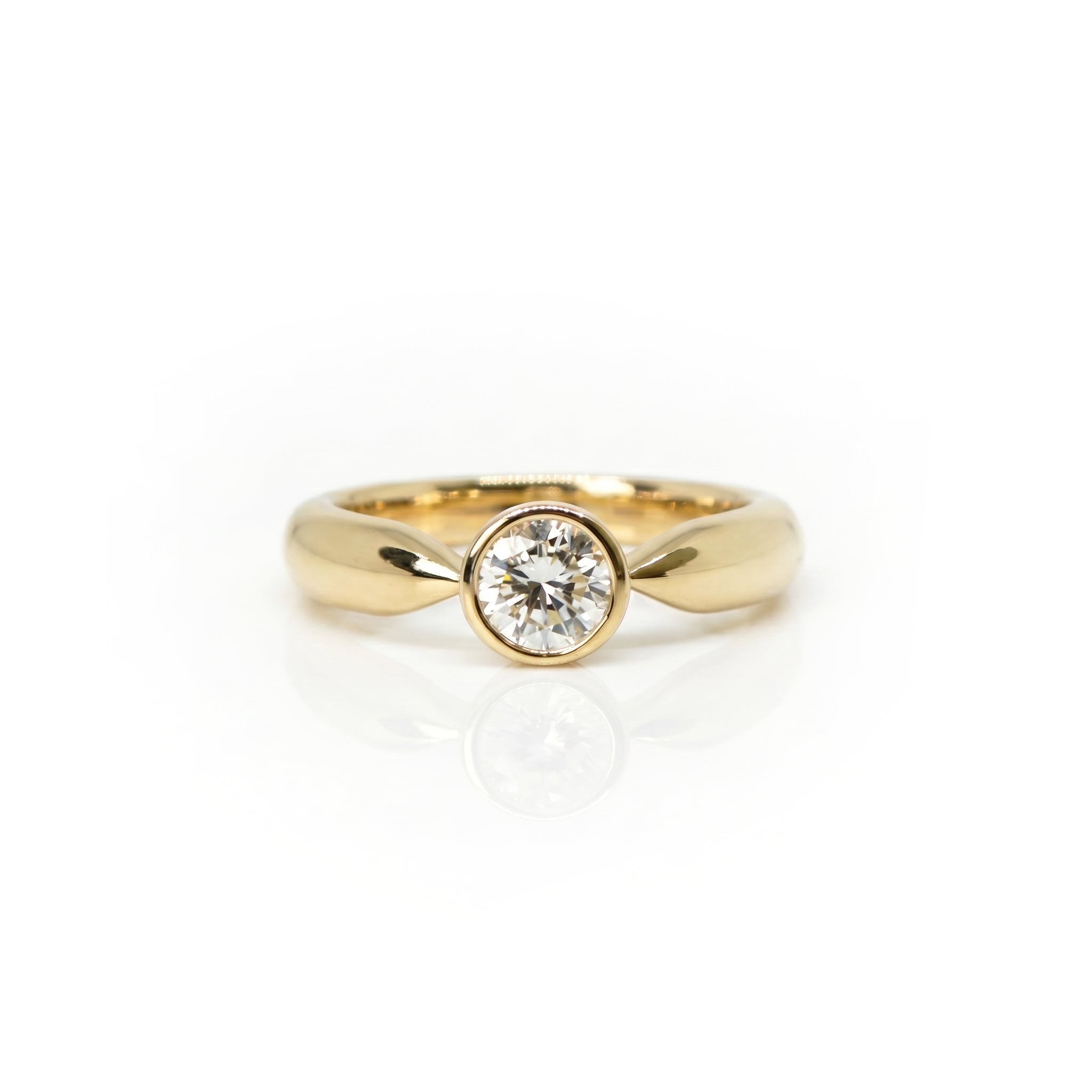 18ct Gold Engagement Ring with n Heirloom Diamond, on a white background.