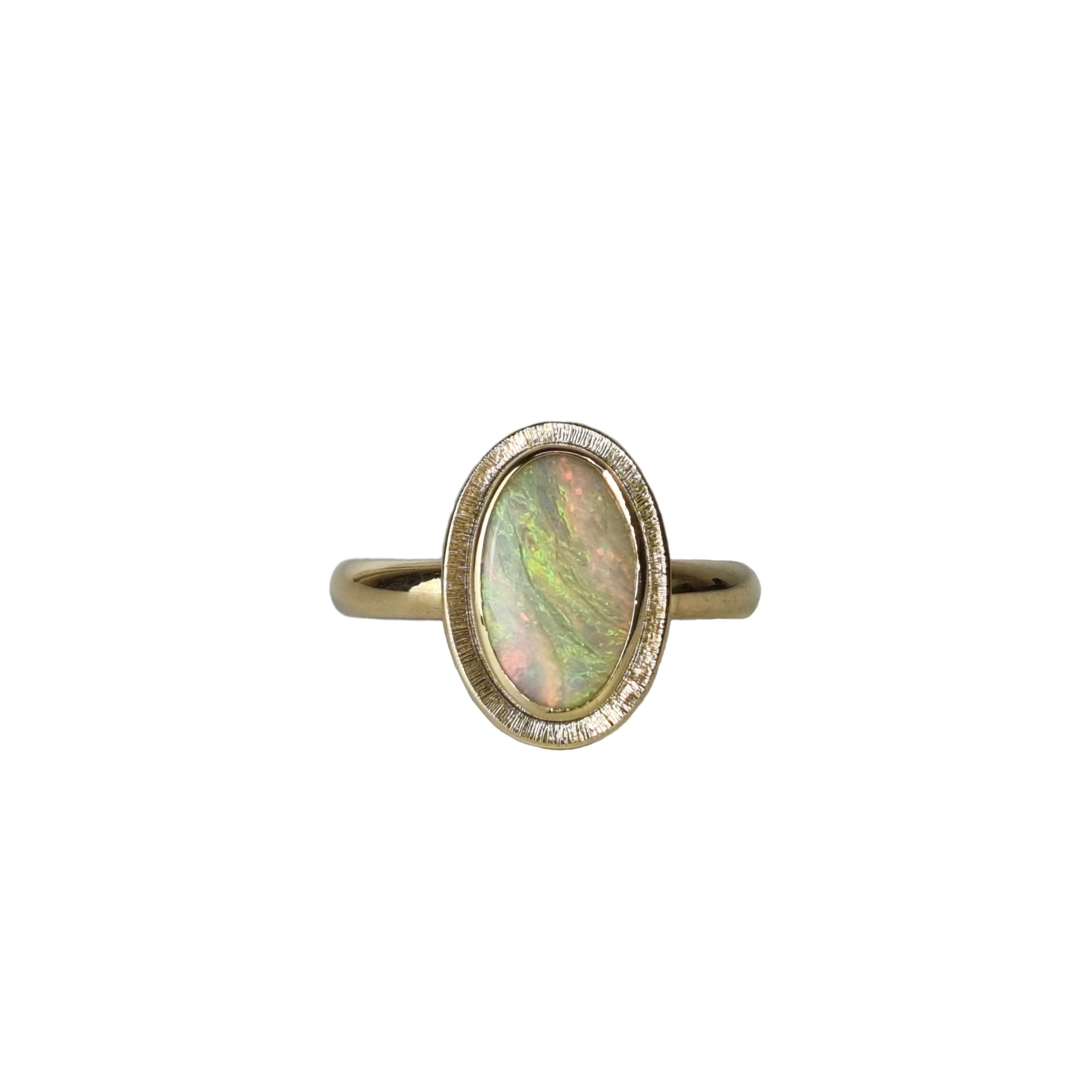 A large Australian Opal Gold ring, with magical green and pink swirls of colour.