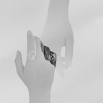 Black and white double exposure photograph of a hand wearing a quartz Prescience Ring by Emily Eliza Arlotte. Photo by Cassie Sullivan.