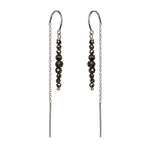 Pyrite and Sterling Silver Thread Earrings on a white background, handmade by Emily Eliza Arlotte in Hobart, Tasmania.