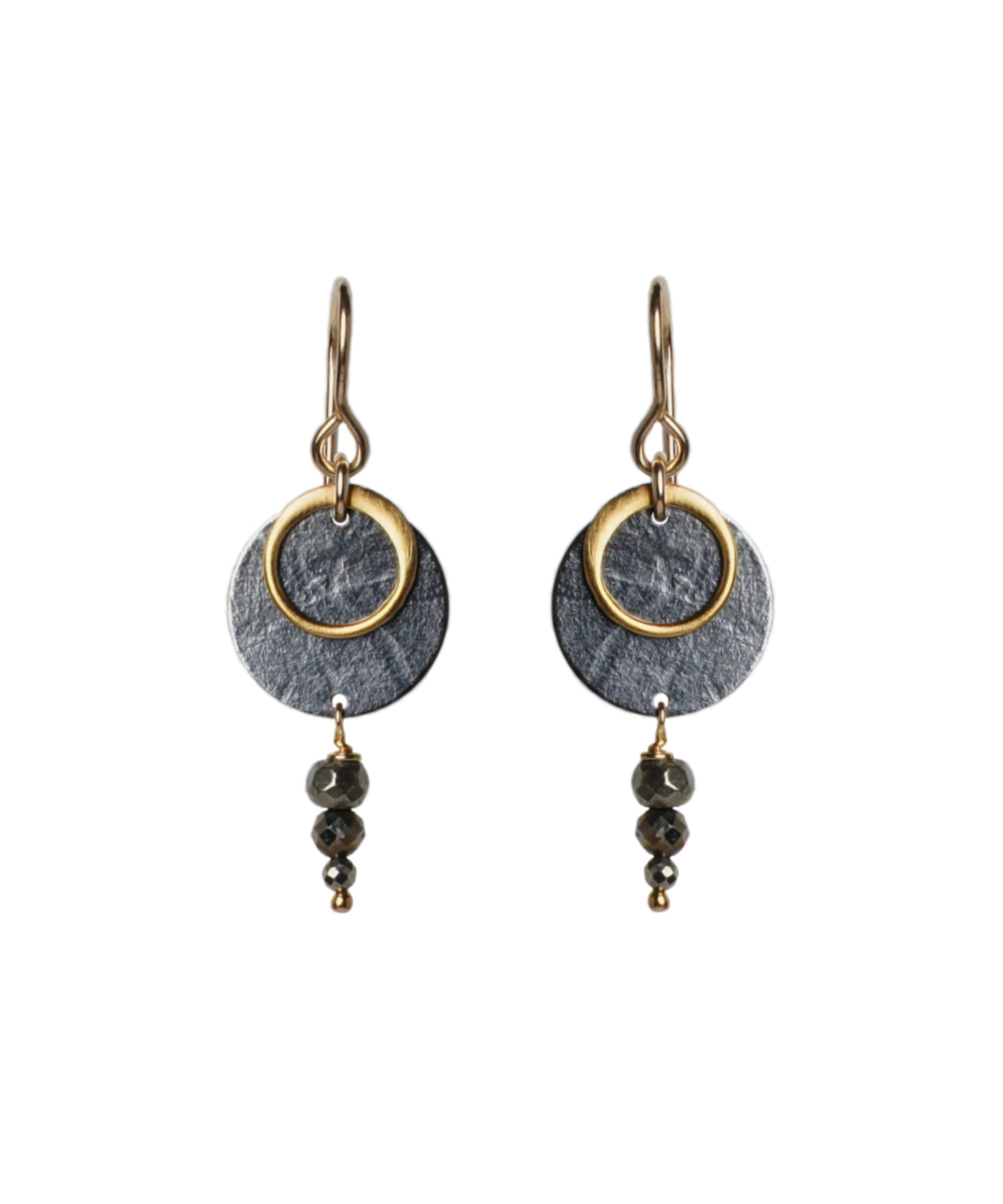 A pair of Zenith II Hook earrings, featuring a geometric design, mixed metals of gold and oxidised silver plus Pyrite gemstones. The earrings are handmade by Emily Eliza Arlotte in Hobart Tasmania from Sterling Silver, 14ct Gold-filled details and Pyrite.