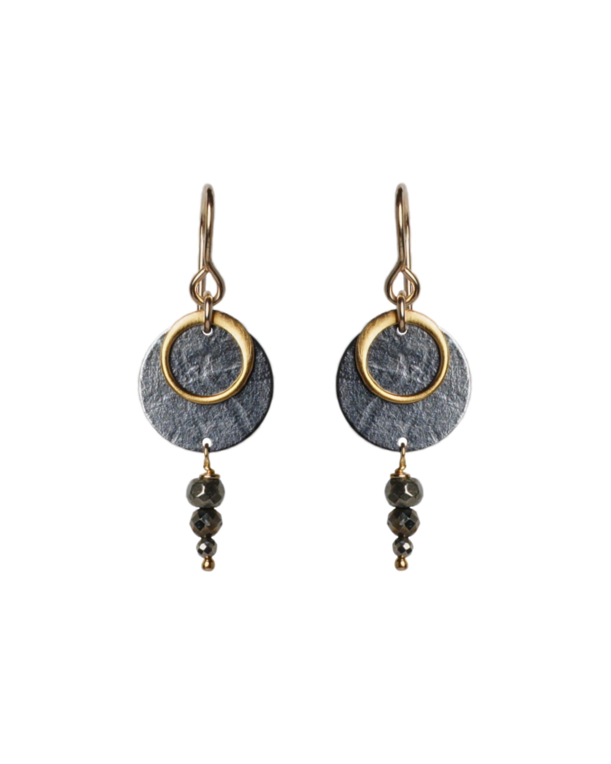 A pair of Zenith II Hook earrings, featuring a geometric design, mixed metals of gold and oxidised silver plus Pyrite gemstones. The earrings are handmade by Emily Eliza Arlotte in Hobart Tasmania from Sterling Silver, 14ct Gold-filled details and Pyrite.