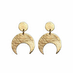 Gold crescent moon earrings on a white background