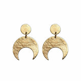 Gold crescent moon earrings on a white background