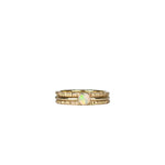 Three-piece Crystal Opal Gold Stack Ring Set displayed on a white background, highlighting the unique transparency and kaleidoscope of colours of the Australian Crystal Opal