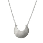 Sterling Silver Luna Crescens necklace featuring a crescent moon on a white background