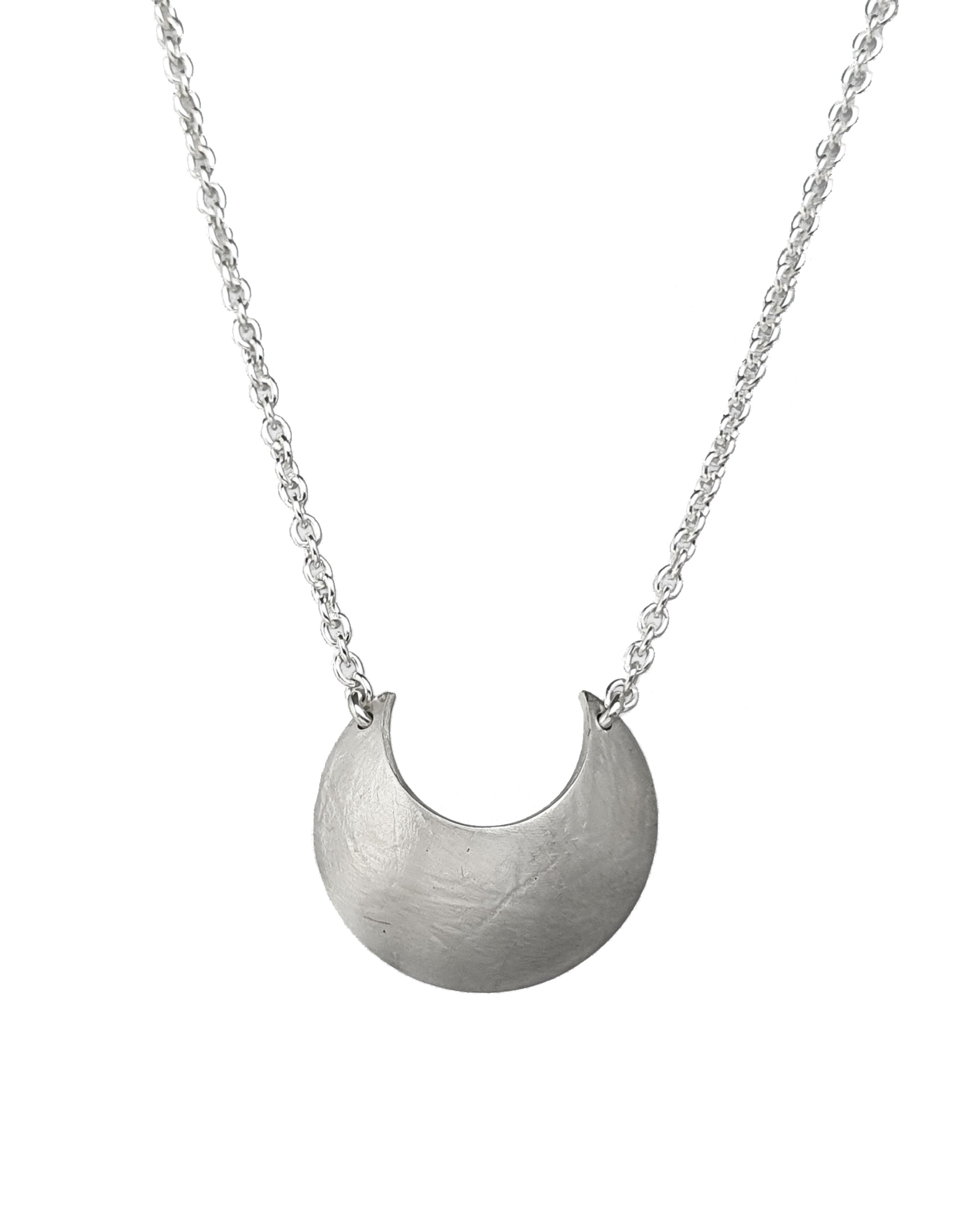 Sterling Silver Luna Crescens necklace featuring a crescent moon on a white background