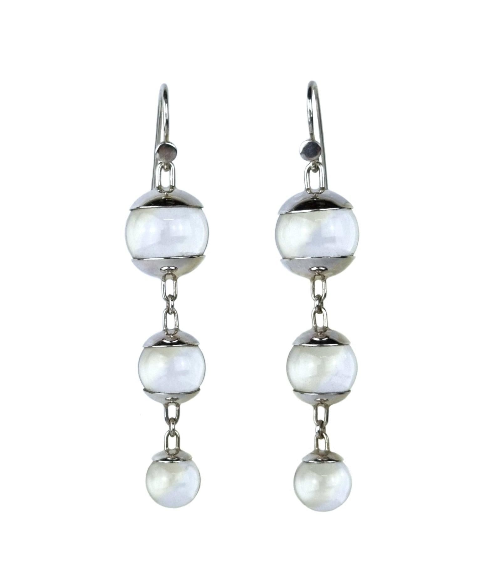 A pair of sterling silver drop earrings featuring three quartz spheres attached to small silver hooks.