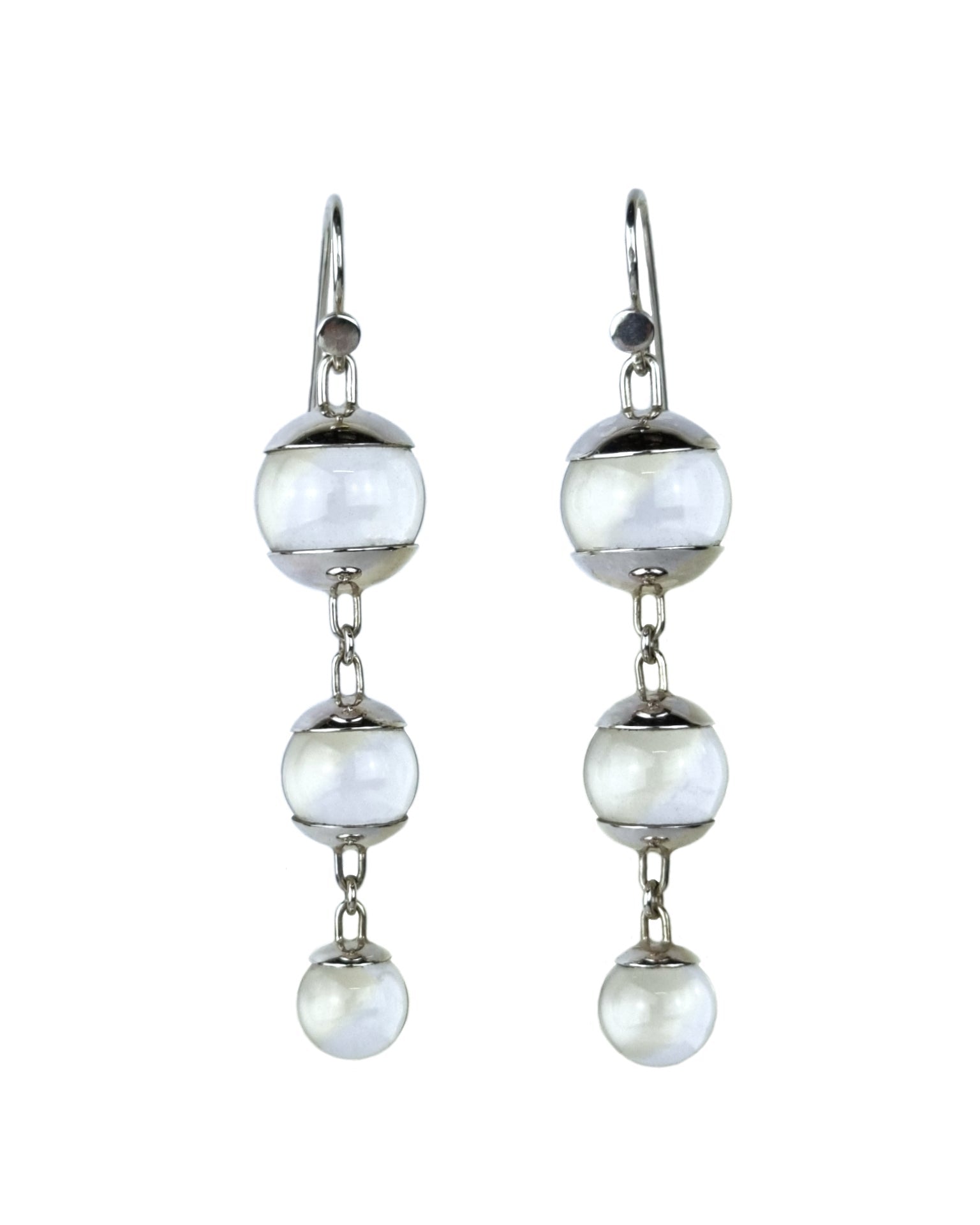 A pair of sterling silver drop earrings featuring three quartz spheres attached to small silver hooks.