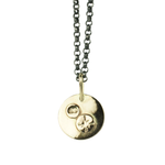 Gold pendant necklace with a white background