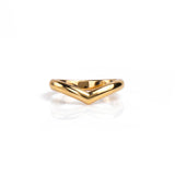 A polished gold wedding ring with a wide, open chevron or V-shaped design, displayed on a clean white reflective surface. Handmade by Emily Eliza Arlotte in Hobart, Tasmania.