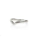 A side view of a Sterling Silver Wishbone Wedding Ring, sitting on a white reflective surface. Handmade by Emily Eliza Arlotte in Hobart, Tasmania.
