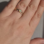 Crystal Opal Gold Stack Ring Set worn in bright sunlight, capturing the shifting colours of the Australian Crystal Opal and the intricate texture of the Silver rings