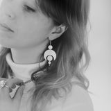 Eden wearing the Celestial Earrings and Labradorite Choker Necklace. The image, photographed by Cassie Sullivan in black and white in an editorial style, has soft and whimsical lighting. Jewellery handmade by Emily Eliza Arlotte in Hobart, Tasmania.