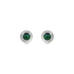 A pair of handmade opal stud earrings by Emily Eliza Arlotte, featuring forest green opals and an engraved textured halo, on a white background.
