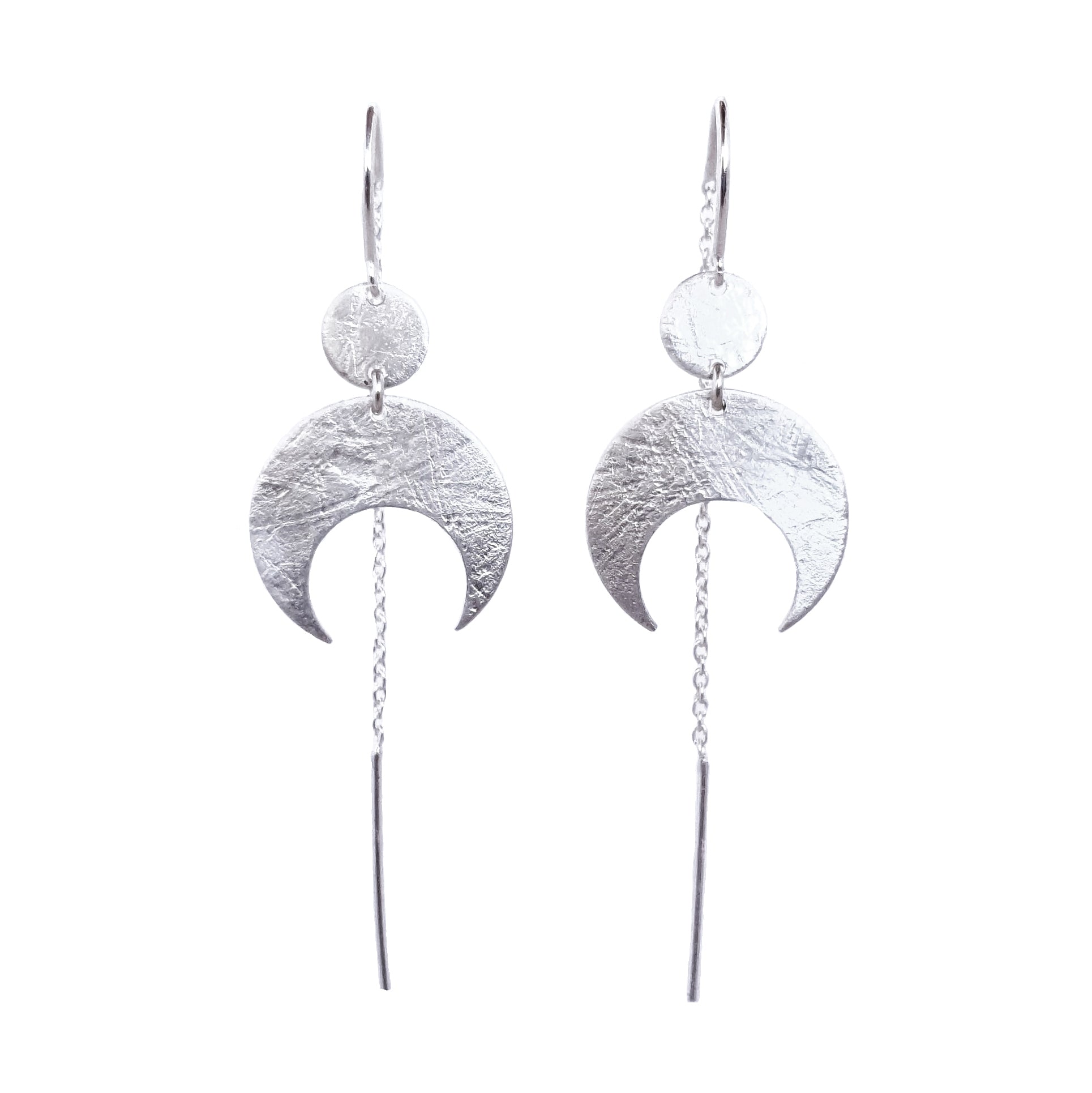 Lunar Thread Earrings on a white background. These sterling silver earrings feature a textured disc and crescent moon hanging from a hook and fine chain fitting.
