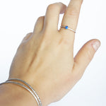 Emily Eliza Arlotte Handcrafted Fine Jewellery - Sterling Silver Opal Dainty Galaxy Ring Worn Hand on white background Bangles Textured