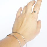 Emily Eliza Arlotte Handcrafted Fine Jewellery - Sterling Silver Opal Dainty Galaxy Ring Worn Hand on white background Bangles Textured